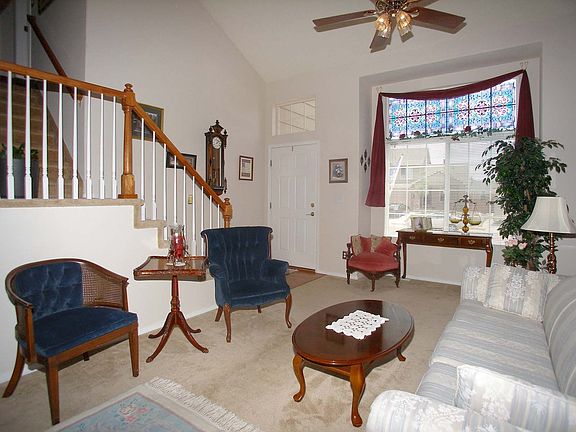 Enter into generous formal living/dining area with vaulted ceilings