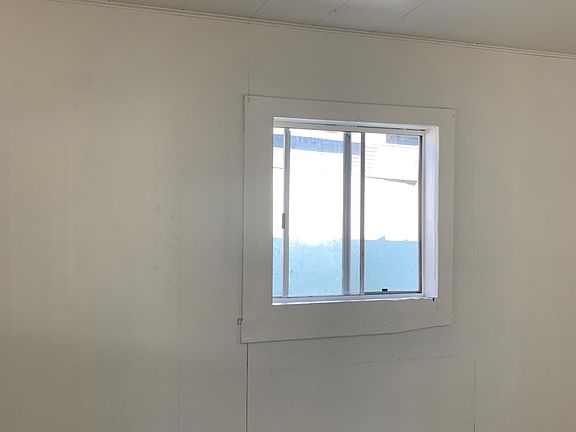 Living room with a window adds great lighting.