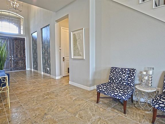 The entry features plenty of wall space for art work!