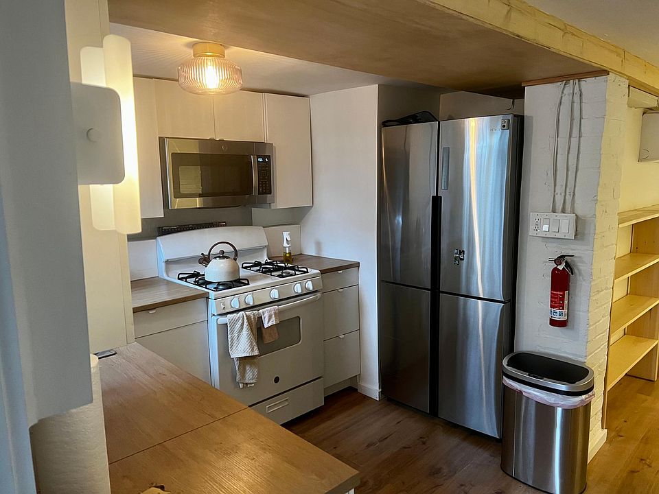 Newly updated kitchen with 4-door fridge and plenty of cabinet storage