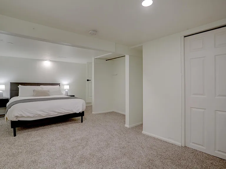 Bedroom 3 with queen bed. This bedroom is downstairs and has 6 1/2 foot ceilings.