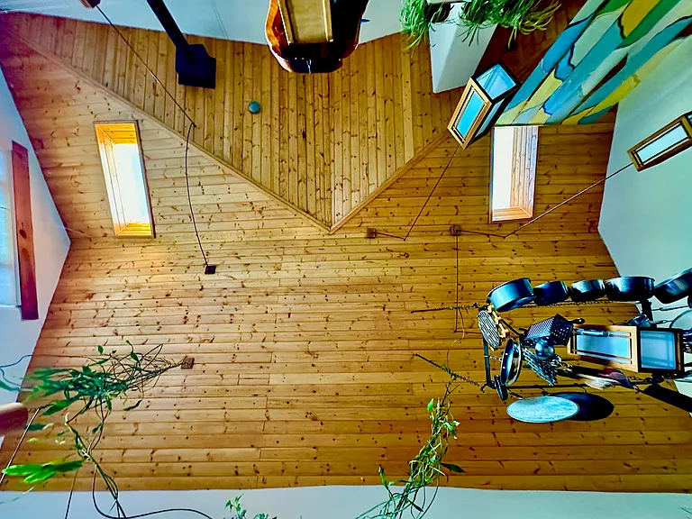 Great Room Idaho Pine tongue & groove Ceiling with suspended custom light fixtures.