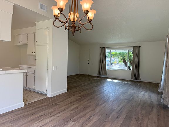 View of the dining area and living room from the patio door