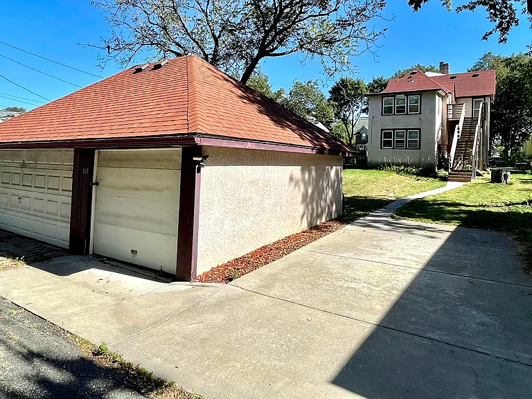 Parking slab for upper unit, and one parking spot in garage.