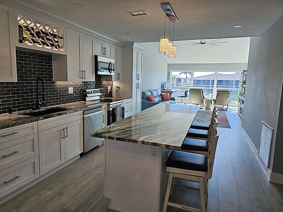 Completely remodeled fully stocked kitchen with 9' center island.