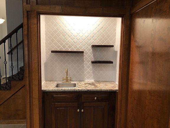 Wet Bar/ Coffee Bar- New tile and floating shelves with new brass faucet and pulls