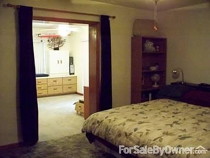 Master Bdrm & archway into Mstr Addition
						:
						Large Master bedroom with passthrough into same size Bonus Room Additon.