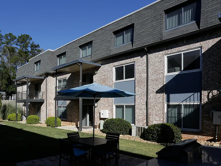 Explore this charming apartment complex with modern amenities and a welcoming outdoor space.