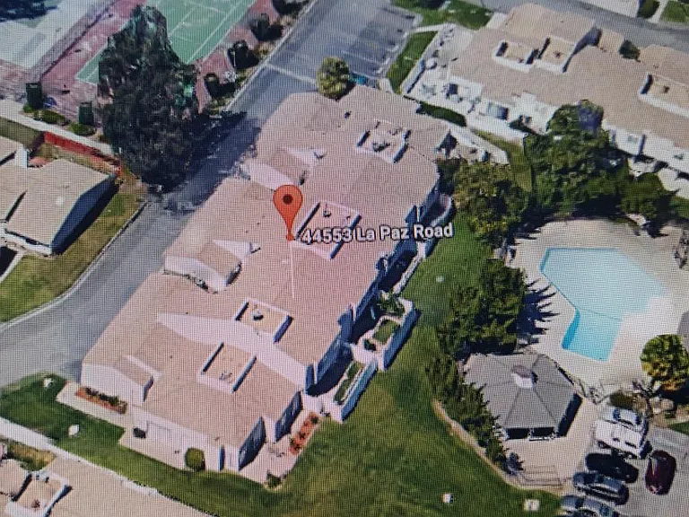 view from overhead shows our unit with the second fenced yard. There is a gate to the grassy area for kids to play. Pool is just across from the townhouse.