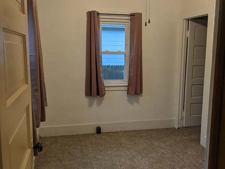 Bedroom #1, adjacent to kitchen. Connects to bedroom #2. Perfect for a nursery!
