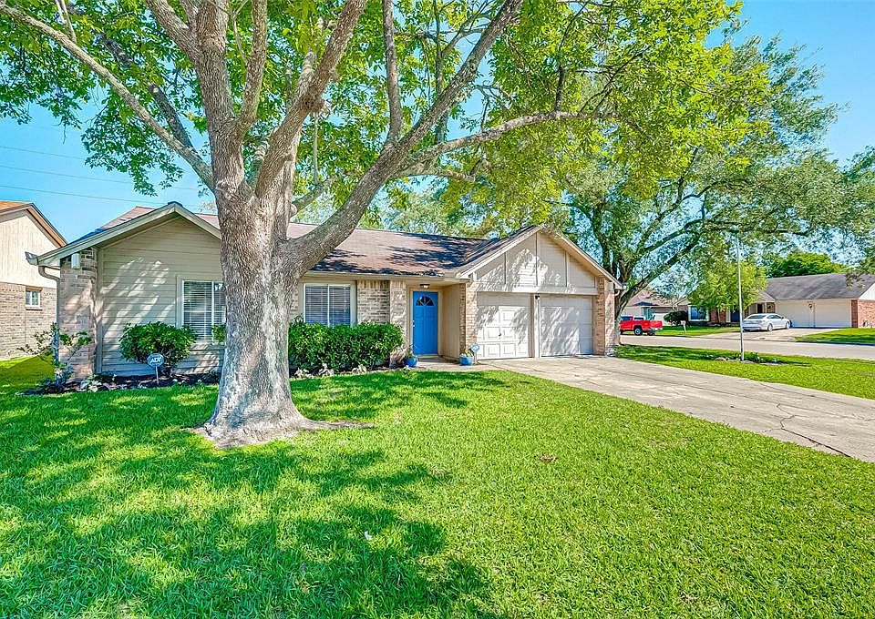 Outstanding updated 1-story home nestled under mature landscaping with a 2-car garage on a corner lot.