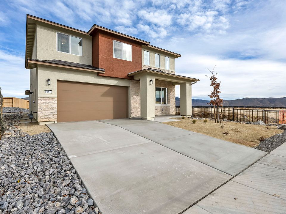 Exterior of beautiful home with 2-car garage.