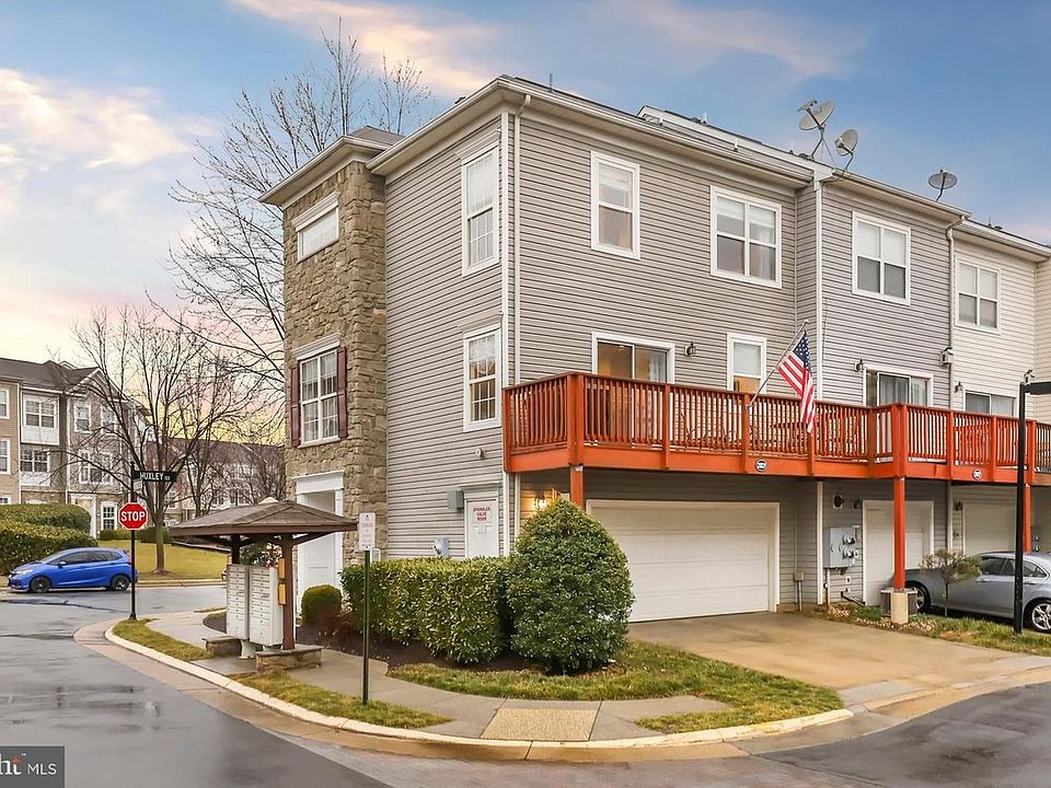 Backside with Deck and Garage door.