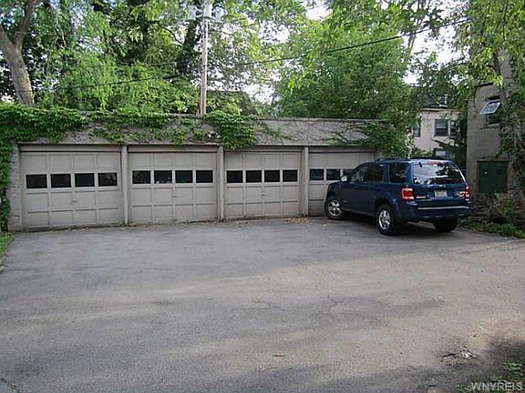 four car garage at the back. left two spots are for the front unit and the right two spots are for the back unit. 
The left two spots come with the front unit rent.