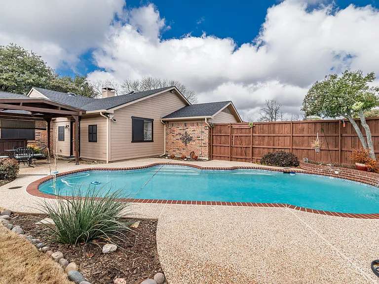 Family friendly swimming pool in private backyard