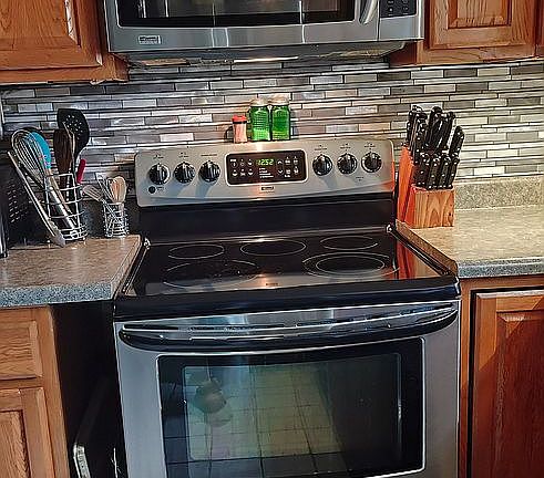 Stove, microwave, backsplash