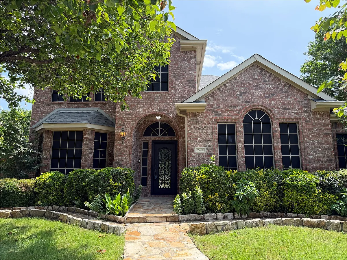 Stunning brick facade and winding stone walkway. - 7720 Mapleridge Dr