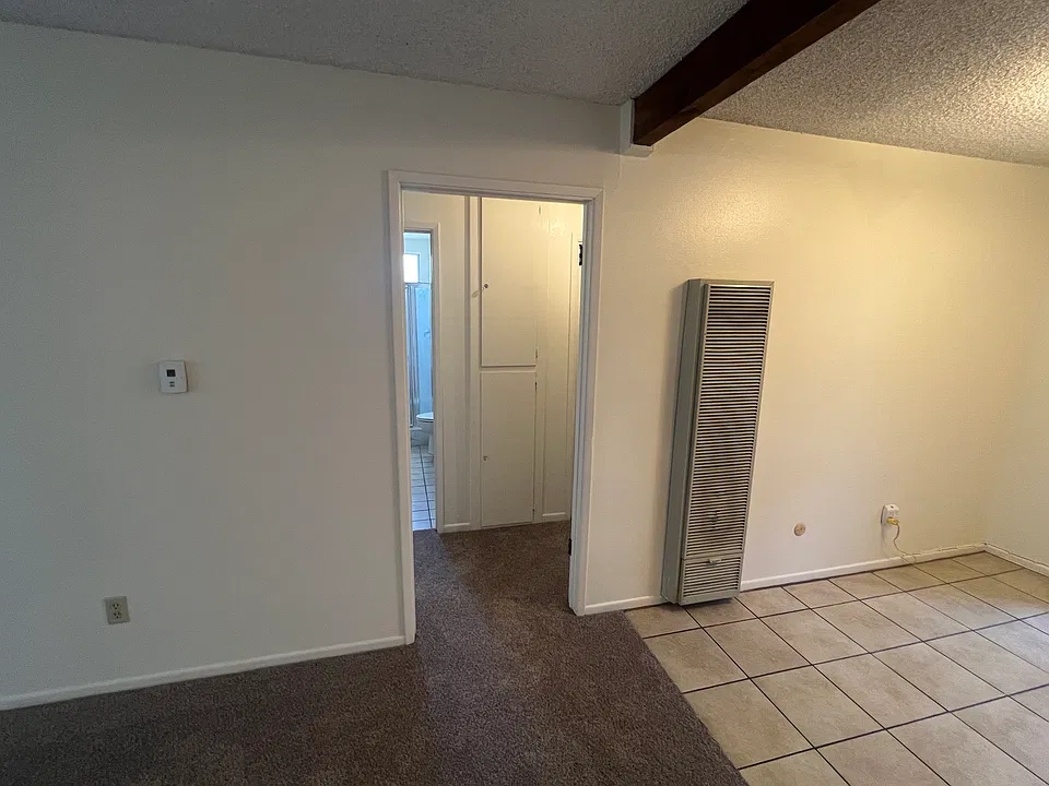 hallway leading to bedrooms, bathrooms and laundry area