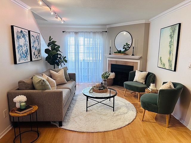 Open living area with fireplace and access to one of two patios