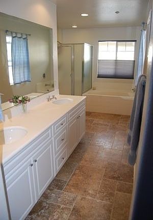 Huge Master bath with tumbled travertine floors