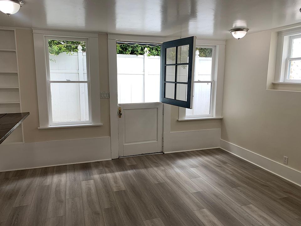 Living room with dutch door and plenty of windows