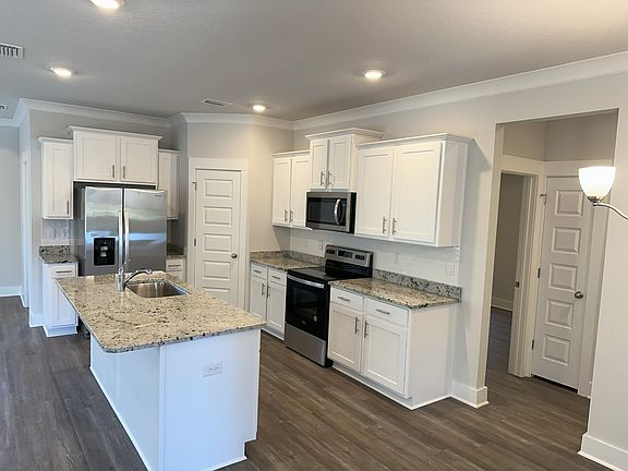 New appliances, granite counter tops, soft-close cabinets, and walk-in pantry.