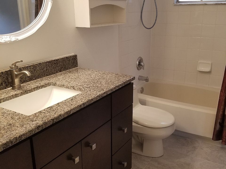 Upstairs full bath with granite and tile floors
