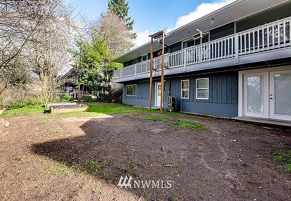 Back of home with Upper decking.