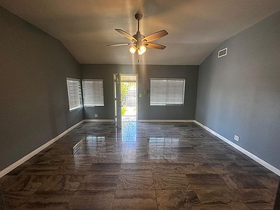 Living room with ample space for your furniture, with front door leading to the front yard.