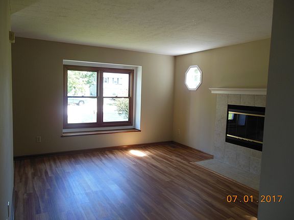 Front room w/FP and octagonal windows