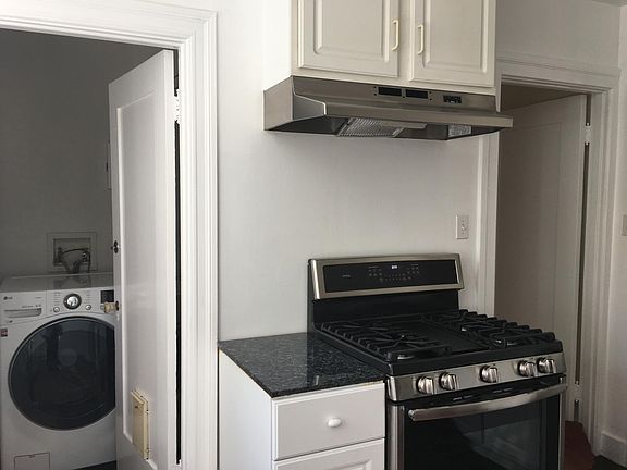 KITCHEN- STAINLESS STEEL REFRIGIRATOR, BRAND NEW DISHWASHER AND STOVE.