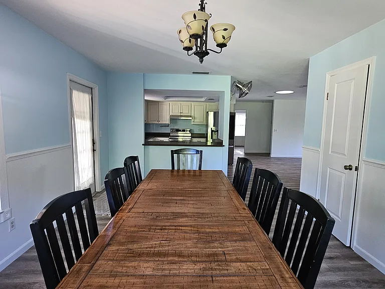 Dining room looking towards kitchen and kitchen bar.