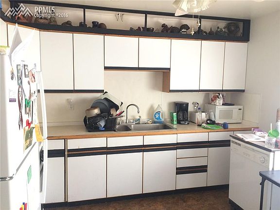 Large kitchen with new frig.