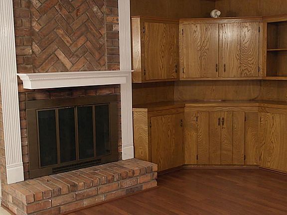 Fireplace with updated mantle and built in TV unit