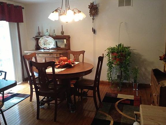 Dining with Sliding Glass Door Leads to Deck