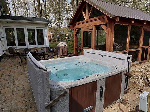 Hot tub with hard cover