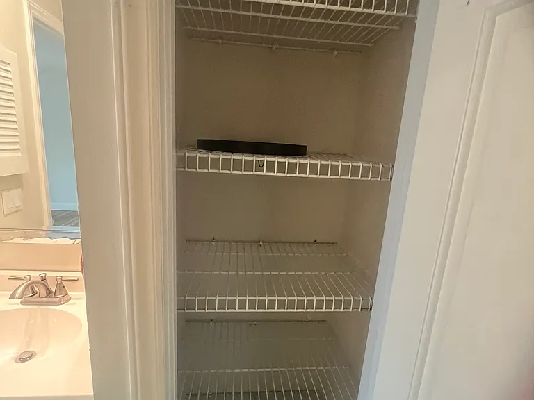 Linen closet in bathroom.
