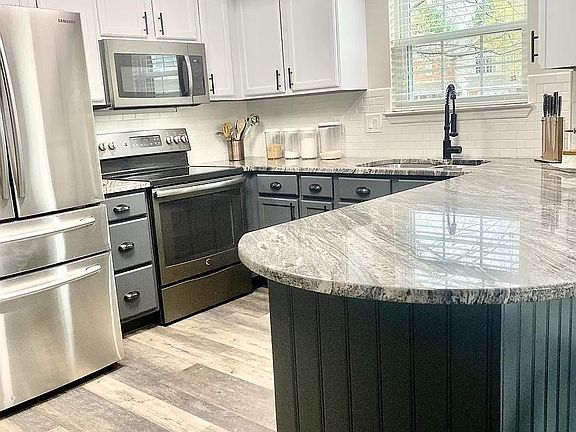 Oversized granite counters and kitchen window!
