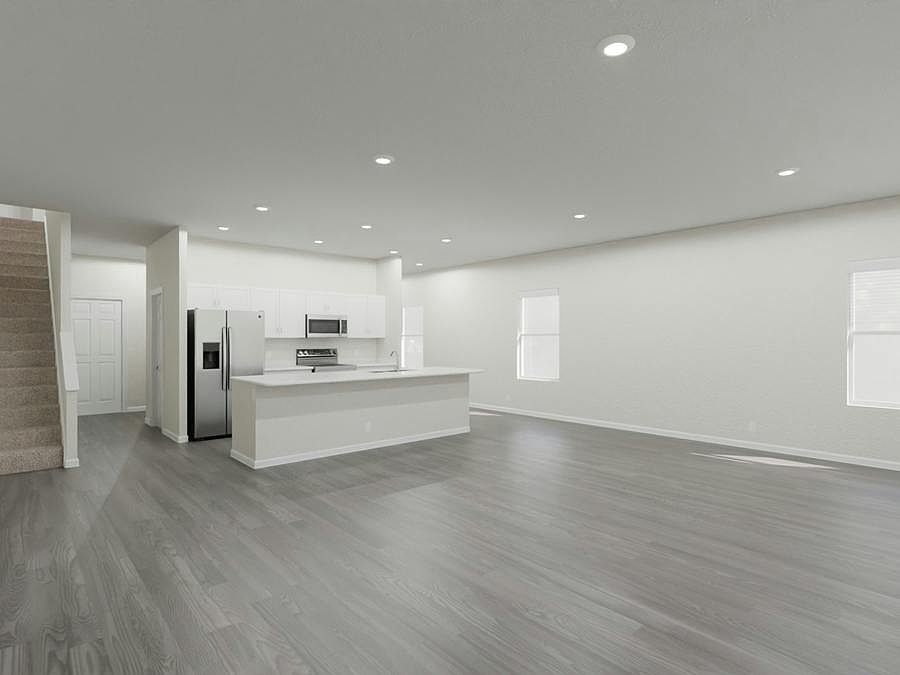 Brand-new open layout, end-unit townhome for sale in St. Cloud, FL, with a 2-car garage!