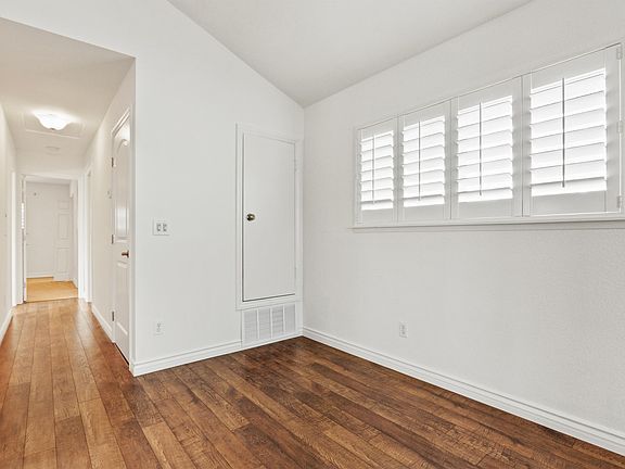 Dining area and hallway leading to bedrooms and baths.