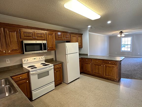 Kitchen has lots of cabinet storage.