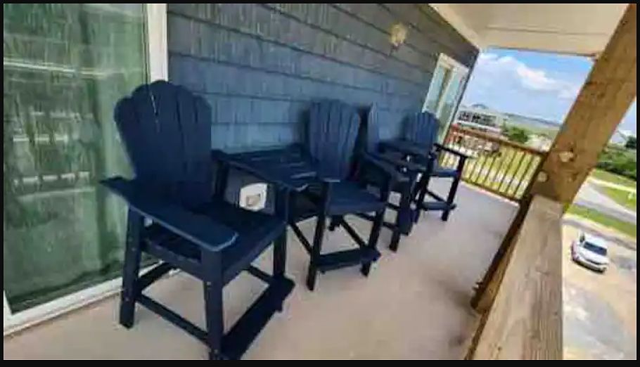 Tall adirondack chairs with views to the ocean and sound.