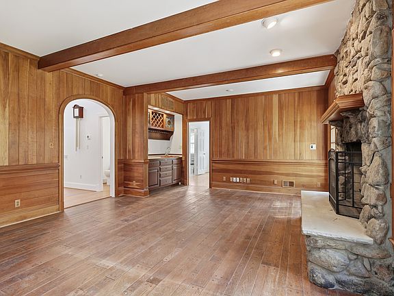 Warm, inviting family room with stone fireplace.