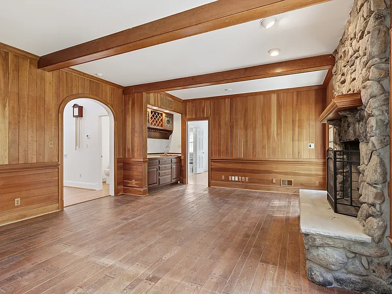Warm, inviting family room with stone fireplace.