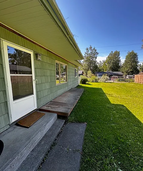 Front of duplex entry and shared yard.