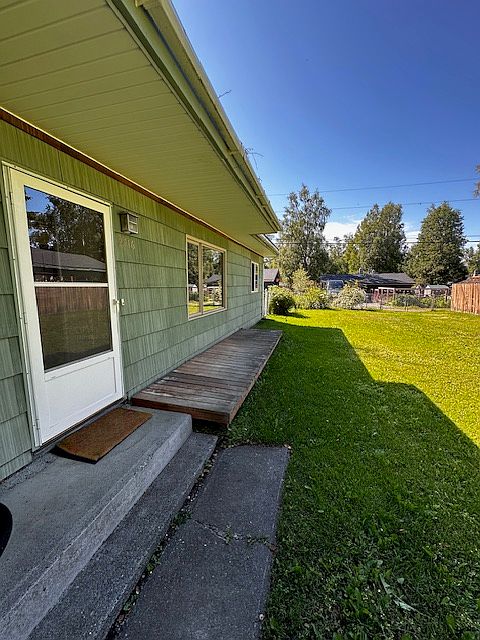 Front of duplex entry and shared yard.