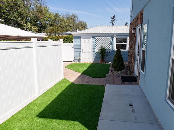 Front of house and fence.