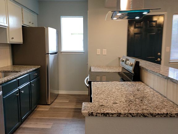 Spacious, functional kitchen has been upgraded with granite countertops and new appliances and plenty of storage space.