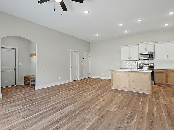 Recessed lighting accentuates the high ceilings