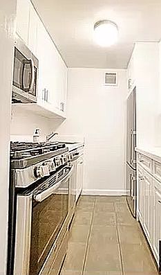 3rd image of 15 E 9th St #8